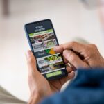 man-using-mobile-app-to-order-delivery-food-2021-08-27-14-48-21-utc (1) (1)